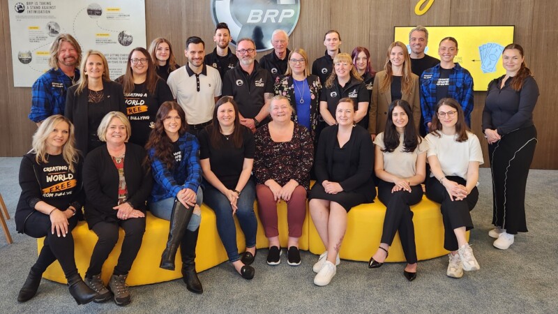 Group photo of diverse people smiling and posing together indoors at the World Anti-Bullying Forum event in Stavanger, Norway, June 2025.