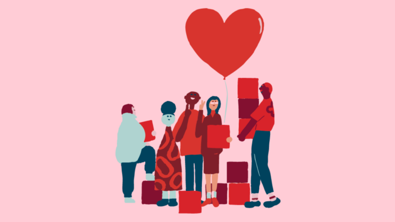 Piirretty, yksinkertaistettu kuva monimuotoisesta ryhmästä ihmisiä vaaleanpunaisella taustalla; he seisovat yhdessä, osa pitää laatikoita ja heidän yläpuolellaan kohoaa sydämen muotoinen ilmapallo, symboloiden yhteisöä ja tukea.